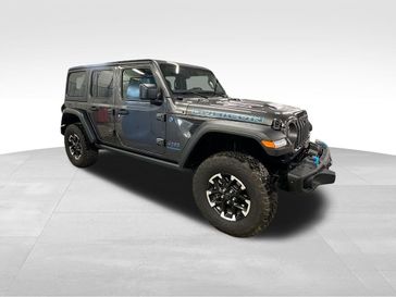 2024 Jeep Wrangler 4-door Rubicon 4xe in a Granite Crystal Metallic Clear Coat exterior color and Blackinterior. Sheridan Motors CDJR 307-218-2217 sheridanmotor.com 