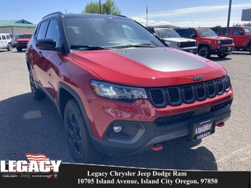 2023 Jeep Compass Trailhawk 4x4 in a Redline Pearl Coat exterior color and Ruby Red/Blackinterior. Legacy Chrysler Jeep Dodge RAM 541-663-4885 legacychryslerjeepdodgeram.com 