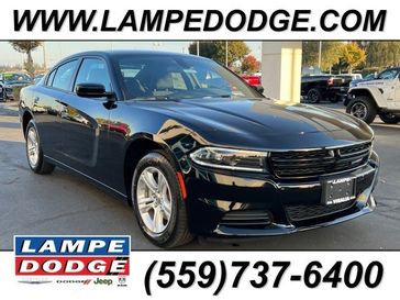 2023 Dodge Charger SXT Rwd in a Pitch Black exterior color and Blackinterior. Lampe Chrysler Dodge Jeep RAM 559-471-3085 pixelmotiondemo.com 