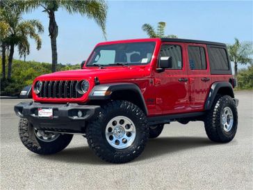 Used 2024 Jeep Wrangler Sport S 4 Door 4x4 in a Firecracker Red Clear Coat exterior color and Blackinterior. Southbay Chrysler Jeep Dodge Ram (424) 404-5521 pixelmotiondemo.com 