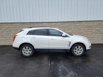 2012 Cadillac SRX Base in a Platinum Ice Tri Coat exterior color and Titanium w/Ebony accentsinterior. Wilmington Auto Center Chrysler Dodge Jeep Ram (937) 556-6430 wilmingtonautocentercdjr.com 