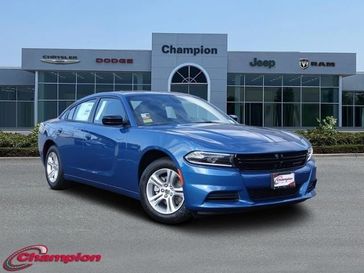 2023 Dodge Charger SXT Rwd in a Frostbite exterior color and HOUNDSTOOTHinterior. Champion Chrysler Jeep Dodge Ram 800-549-1084 pixelmotiondemo.com 
