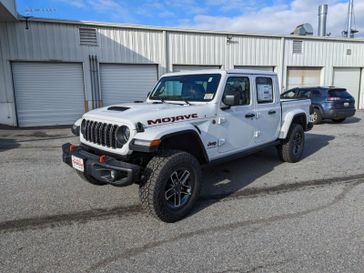 2024 Jeep GLADIATOR MOJAVE X 4X4 in a Bright White Clear Coat exterior color. Don White's Timonium Chrysler Dodge Jeep Ram 410-881-5409 donwhites.com 