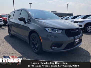 2023 Chrysler Pacifica Plug-in Hybrid Touring L in a Ceramic Gray Clear Coat exterior color and Blackinterior. Legacy Chrysler Jeep Dodge RAM 541-663-4885 legacychryslerjeepdodgeram.com 
