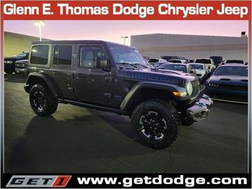 2024 Jeep Wrangler 4-door Rubicon 4xe in a Granite Crystal Metallic Clear Coat exterior color and Blackinterior. Glenn E Thomas 100 Years Of Excellence (866) 340-5075 getdodge.com 