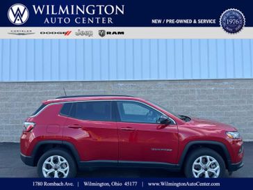 2025 Jeep Compass Latitude 4x4 in a Red Hot Pearl Coat exterior color. Wilmington Auto Center Chrysler Dodge Jeep Ram (937) 556-6430 wilmingtonautocentercdjr.com 