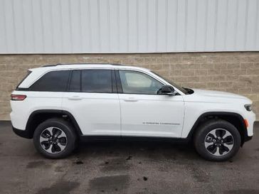 2023 Jeep Grand Cherokee 4xe WLXP74 in a Bright White Clear Coat exterior color and Global Blackinterior. Wilmington Auto Center Chrysler Dodge Jeep Ram (937) 556-6430 wilmingtonautocentercdjr.com 