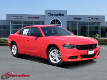 2023 Dodge Charger SXT Rwd in a TorRed exterior color and HOUNDSTOOTHinterior. Champion Chrysler Jeep Dodge Ram 800-549-1084 pixelmotiondemo.com 