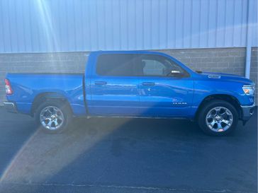 2021 RAM 1500 Big Horn 4x4 Crew Cab 57 Box in a Hydro Blue Pearl Coat exterior color and Blackinterior. Wilmington Auto Center Chrysler Dodge Jeep Ram (937) 556-6430 wilmingtonautocentercdjr.com 