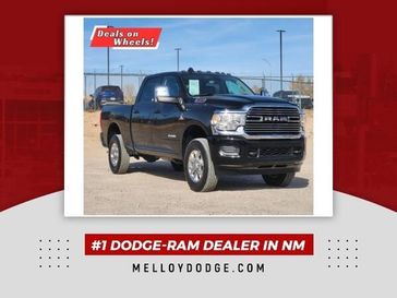 2023 RAM 3500 Laramie in a Diamond Black Crystal Pearl Coat exterior color and Blackinterior. Melloy Dodge RAM FIAT 505-588-4459 melloydodge.com 