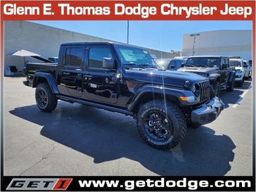 2023 Jeep Gladiator Willys 4x4 in a Black Clear Coat exterior color and Blackinterior. Glenn E Thomas 100 Years Of Excellence (866) 340-5075 getdodge.com 