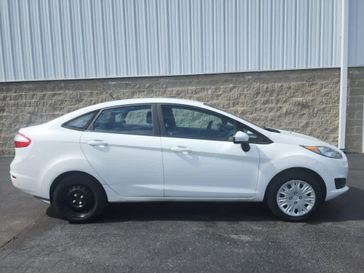 2019 Ford Fiesta S in a Oxford White exterior color and Charcoal Blackinterior. Wilmington Auto Center Chrysler Dodge Jeep Ram (937) 556-6430 wilmingtonautocentercdjr.com 