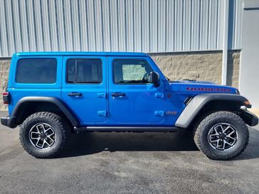 2024 Jeep Wrangler 4-door Rubicon in a Hydro Blue Pearl Coat exterior color and BLACKinterior. Wilmington Auto Center Chrysler Dodge Jeep Ram (937) 556-6430 wilmingtonautocentercdjr.com 