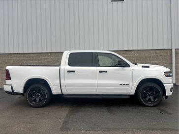 2025 RAM 1500 Big Horn Crew Cab 4x4 5'7' Box in a Bright White Clear Coat exterior color. Wilmington Auto Center Chrysler Dodge Jeep Ram (937) 556-6430 wilmingtonautocentercdjr.com 