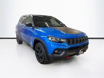 2023 Jeep Compass Trailhawk 4x4 in a Laser Blue Pearl Coat exterior color and Ruby Red/Blackinterior. Sheridan Motors CDJR 307-218-2217 sheridanmotor.com 