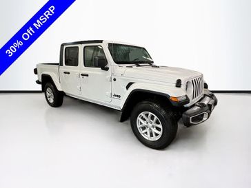 2023 Jeep Gladiator Sport S 4x4 in a Bright White Clear Coat exterior color and Blackinterior. Sheridan Motors CDJR 307-218-2217 sheridanmotor.com 