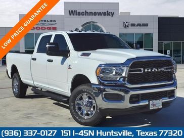 2024 RAM 2500 Tradesman Crew Cab 4x4 8' Box in a Bright White Clear Coat exterior color and Blackinterior. Wischnewsky Dodge 936-755-5310 wischnewskydodge.com 