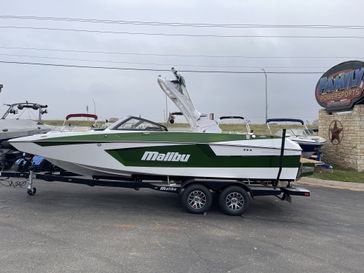 2023 MALIBU Wakesetter 23 MXZ  in a WHITE/GREEN exterior color. Family PowerSports (877) 886-1997 familypowersports.com 