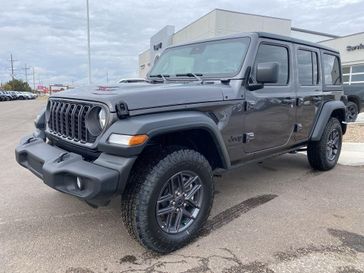 2024 Jeep Wrangler 4-door Sport S in a Granite Crystal Metallic Clear Coat exterior color and Blackinterior. Legacy Auto Center 620-315-9264 legacyautocenter.net 