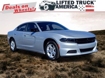 2023 Dodge Charger SXT in a Triple Nickel Clear Coat exterior color and Blackinterior. Lifted Truck America 888-267-0644 liftedtruckamerica.com 