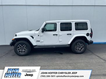 New 2025 Jeep Wrangler  Sahara in a Bright White Clear Coat exterior color. John Hoffer Chrysler Jeep 785-329-4357 johnhofferchryslerjeep.com 