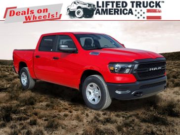 2024 RAM 1500 Tradesman in a Flame Red Clear Coat exterior color and Blackinterior. Lifted Truck America 888-267-0644 liftedtruckamerica.com 