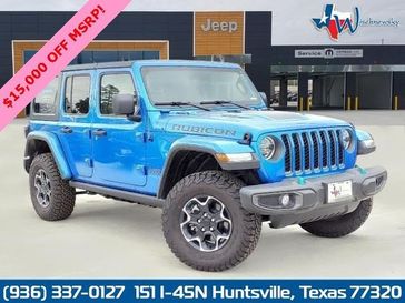 2022 Jeep Wrangler Rubicon 4xe in a Hydro Blue Pearl Coat exterior color and Blackinterior. Wischnewsky Dodge 936-755-5310 wischnewskydodge.com 