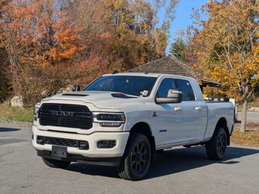 2024 RAM 2500 Laramie Mega Cab 4x4 6'4' Box in a Pearl White exterior color and Blackinterior. Brattleboro CDJR 802-251-1111 brattleborocdjr.com 