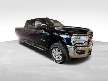 2024 RAM 2500 Laramie Mega Cab 4x4 6'4' Box in a Diamond Black Crystal Pearl Coat exterior color and Blackinterior. Sheridan Motors CDJR 307-218-2217 sheridanmotor.com 