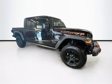 2023 Jeep Gladiator Mojave 4x4 in a Black Clear Coat exterior color and Blackinterior. Sheridan Motors Auto (307) 218-2217 sheridanmotors.com 