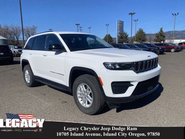 2023 Jeep Grand Cherokee Laredo 4x4 in a Bright White Clear Coat exterior color and Global Blackinterior. Legacy Chrysler Jeep Dodge RAM 541-663-4885 legacychryslerjeepdodgeram.com 