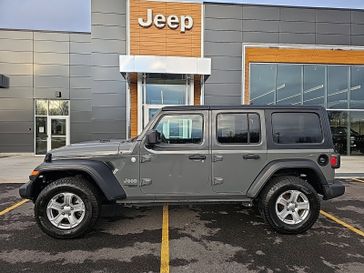 2021 Jeep Wrangler Unlimited Sport S in a Sting-Gray Clear Coat exterior color and Blackinterior. Victor Chrysler Dodge Jeep Ram 585-236-4391 victorcdjr.com 