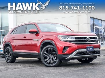 2023 Volkswagen Atlas Cross Sport 3.6L V6 SE w/Technology in a Aurora Red Metallic exterior color and Titan Blackinterior. Glenview Luxury Imports 847-904-1233 glenviewluxuryimports.com 