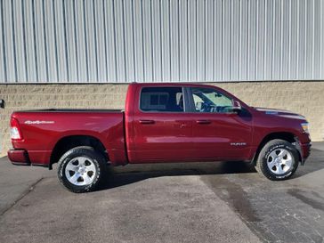 2020 RAM 1500 Big Horn 4x4 Crew Cab 57 Box in a Delmonico Red Pearl Coat exterior color. Wilmington Auto Center Chrysler Dodge Jeep Ram (937) 556-6430 wilmingtonautocentercdjr.com 