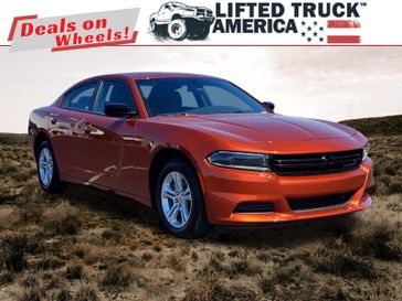 2023 Dodge Charger SXT in a Sinamon Stick exterior color and Blackinterior. Lifted Truck America 888-267-0644 liftedtruckamerica.com 