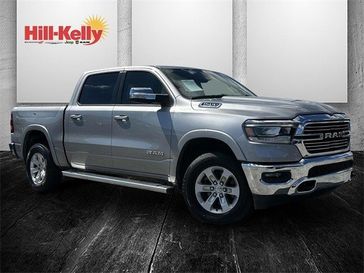 2022 RAM 1500 Laramie in a Billet Silver Metallic Clear Coat exterior color and Lt Frost Beige/Mountaininterior. Hill-Kelly Dodge (850) 786-2130 hillkellydodge.com 