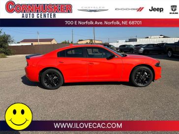 2023 Dodge Charger SXT Awd in a Go Mango exterior color and Blackinterior. Cornhusker Auto Center 402-866-8665 cornhuskerautocenter.com 
