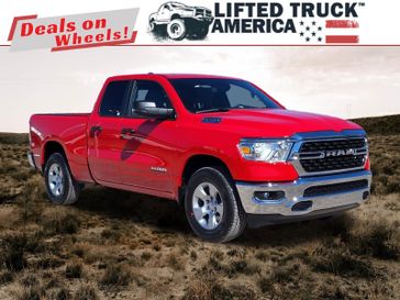 2024 RAM 1500 Big Horn in a Flame Red Clear Coat exterior color and Diesel Gray/Blackinterior. Lifted Truck America 888-267-0644 liftedtruckamerica.com 