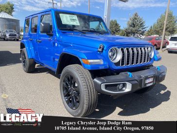 2024 Jeep Wrangler 4-door Sahara 4xe in a Hydro Blue Pearl Coat exterior color and Blackinterior. Legacy Chrysler Jeep Dodge RAM 541-663-4885 legacychryslerjeepdodgeram.com 