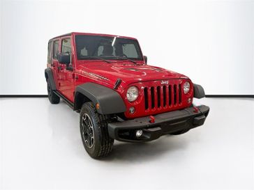 2014 Jeep Wrangler Unlimited Rubicon in a Flame Red Clear Coat exterior color and Blackinterior. Sheridan Motors CDJR 307-218-2217 sheridanmotor.com 