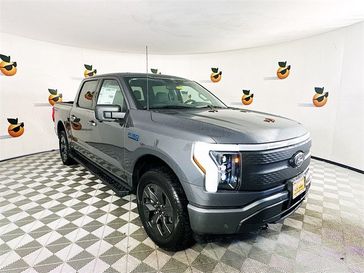 2024 Ford F-150 Lightning XLT in a Carbonized Gray Metallic exterior color and Dark Slateinterior. Ontario Auto Center ontarioautocenter.com 