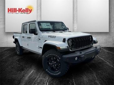 2024 Jeep Gladiator Willys 4x4 in a Bright White Clear Coat exterior color. Hill-Kelly Dodge (850) 786-2130 hillkellydodge.com 