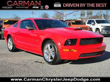 2007 Ford Mustang GT Deluxe in a Redfire Metallic - G2 exterior color and Dark Charcoal - Winterior. Carman Chrysler Jeep Dodge Ram 302-317-2378 carmanchryslerjeepdodge.com 
