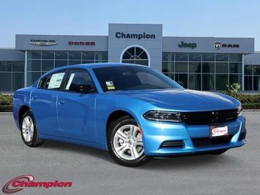 2023 Dodge Charger SXT Rwd in a B5 Blue exterior color and HOUNDSTOOTHinterior. Champion Chrysler Jeep Dodge Ram 800-549-1084 pixelmotiondemo.com 
