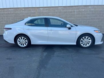 2023 Toyota Camry LE in a Ice Edge exterior color and Blackinterior. Wilmington Auto Center Chrysler Dodge Jeep Ram (937) 556-6430 wilmingtonautocentercdjr.com 