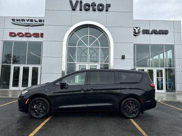 2023 Chrysler Pacifica Plug-in Hybrid Limited in a Brilliant Black Crystal Pearl Coat exterior color and Blackinterior. Victor Chrysler Dodge Jeep Ram 585-236-4391 victorcdjr.com 