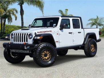Used 2021 Jeep Gladiator Mojave 4x4 in a Bright White Clear Coat exterior color and Blackinterior. Southbay Chrysler Jeep Dodge Ram (424) 404-5521 pixelmotiondemo.com 