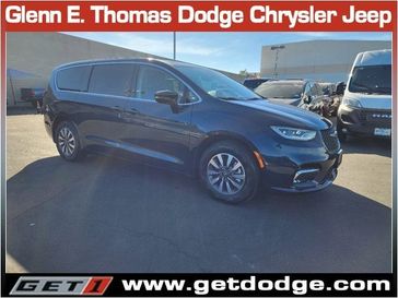 2024 Chrysler Pacifica Plug-in Hybrid Select in a Fathom Blue Pearl Coat exterior color and Black/Alloy/Blackinterior. Glenn E Thomas 100 Years Of Excellence (866) 340-5075 getdodge.com 