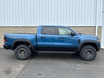 2024 RAM 1500 Trx Crew Cab 4x4 5'7' Box in a Night Edge Blue exterior color and Blackinterior. Wilmington Auto Center Chrysler Dodge Jeep Ram (937) 556-6430 wilmingtonautocentercdjr.com 