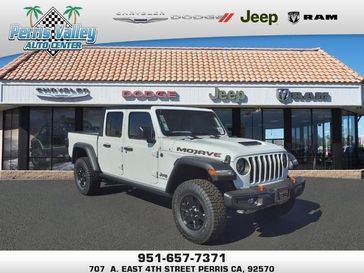 2023 Jeep Gladiator Mojave 4x4 in a Bright White Clear Coat exterior color and Blackinterior. Perris Valley Chrysler Dodge Jeep Ram 951-355-1970 perrisvalleydodgejeepchrysler.com 